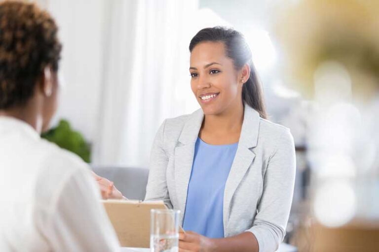 Friendly nurse consulting with a patient about abortion and pregnancy options.