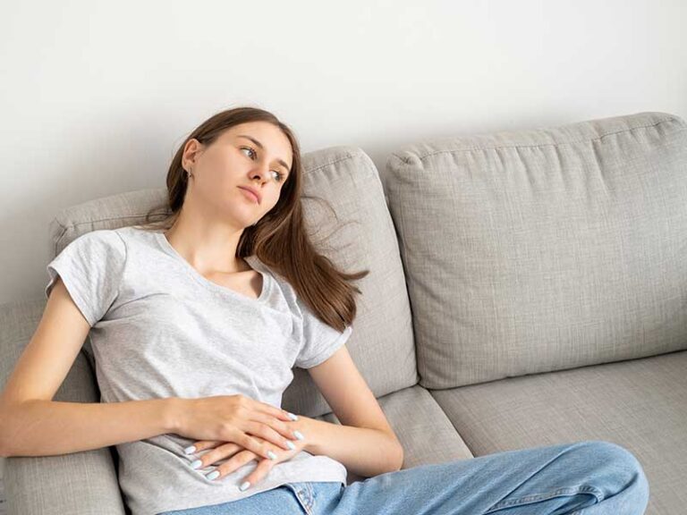 A young woman resting on a couch